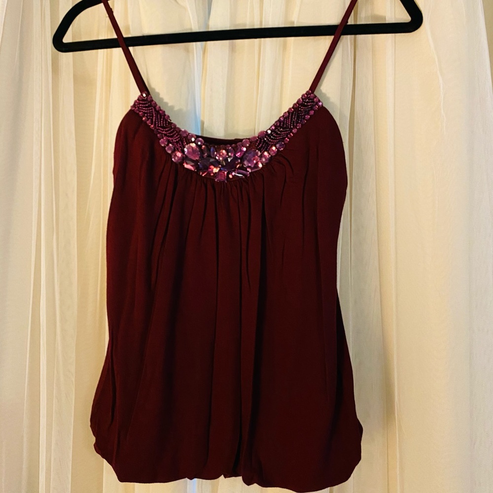 Bubble hem tank top with beading at neckline. M